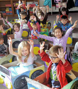 Parkside students at the make believe drive-in in cars each one constructed